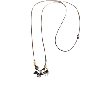 Vintage dachshund long sweater necklace with adjustable brown cord and cute dog pendant.
