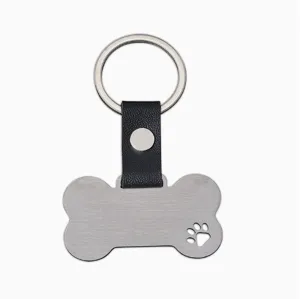 Porte-clés en os en acier inoxydable avec patte creuse, lanière en cuir pour animaux.