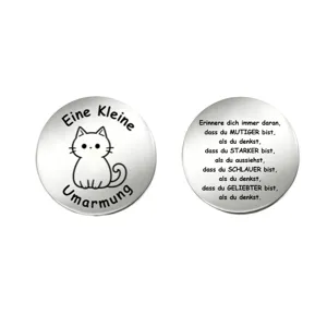 Detail view of a stainless steel pocket hug coin featuring a cute cat and German quotes.