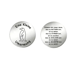 Stainless steel motivational decision coin with cute penguin and inspiring German quote.