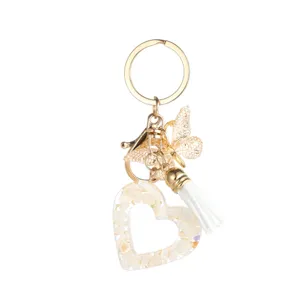 Porte-clés cœur en résine avec joli papillon et gland blanc pour élégant sac à main mode