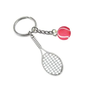 Detailed view of a creative metal tennis racket keychain with a cute pink ball charm.