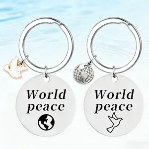 Stainless steel keychain pendant featuring World peace engraving and dove globe charms.