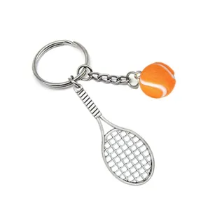 Metal tennis racket keychain with fuzzy mini tennis ball, creative sports souvenir pendant.
