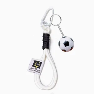 Sports football lanyard keychain with mini soccer ball pendant, durable braided rope design.