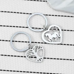 Porte-clés cœur creux en acier inoxydable avec pendentifs licorne et arbre de vie sacs.