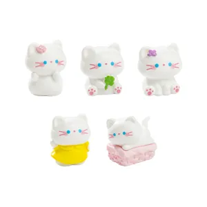 Cute miniature white cat figurines set for spring garden landscaping and DIY desktop decor.