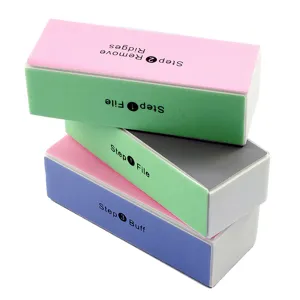 Detailed view of multi-color 4-way nail buffer blocks for smooth polishing and finishing.