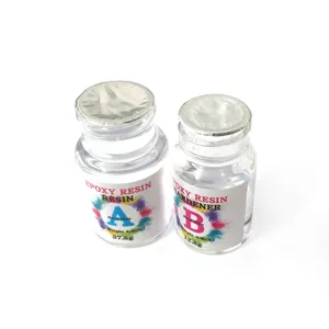 Clear epoxy resin AB glue detail bottle set showing mixing proportions and weights clearly.