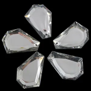 Clear detail shot of transparent acrylic sew-on rhinestones with multi-facets and holes.