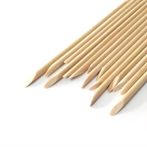 Orange wood nail sticks detail view, perfect for cuticle pusher and nail art dotting tools.