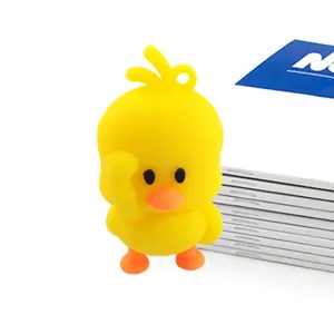 Cute yellow duck cartoon figurine detail view, small pendant keychain for bags and car keys.