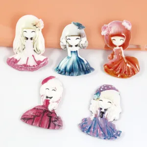 Detailed close-up of cute cartoon princess resin flatback charms for DIY crafts and phone cases.
