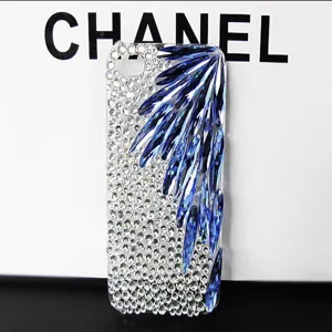 Crystal rhinestone phone case detail showing sparkling blue wing pattern and clear rhinestones.