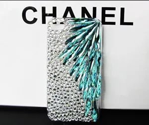 Detailed view of handmade rhinestone phone case with teal teardrop crystal feathers design.