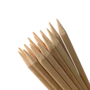 Wood cuticle sticks detail view, natural wooden nail art tools for manicure and dotting.