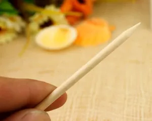 Natural wooden orangewood stick for nail art, cuticle pusher and rhinestone placement.