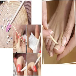 Detail view of orange wood cuticle sticks for nail art, rhinestones picking and dead skin cleaning.