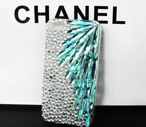 Crystal rhinestone phone case DIY accessory featuring teal teardrop shaped gemstones.