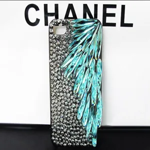 Rhinestone crystal phone case with turquoise teardrop stones for sparkling everyday protection style.