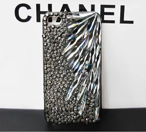 Rhinestone crystal phone case detail featuring sparkly teardrop gems in wing design.