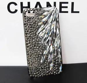 Close-up view of rhinestone phone case featuring sparkling crystal drop stones and flatback diamonds.