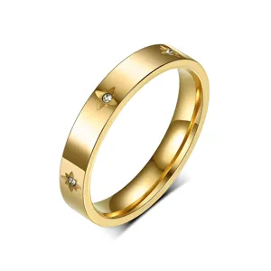 Detailed view of titanium steel gold-plated couple ring with sparkling zircon star-set design.