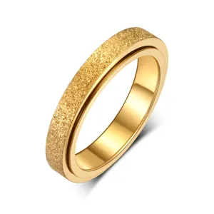 Goldener Antistress Ring aus Edelstahl, drehbarer Zappelring mit matter Textur, elegant.