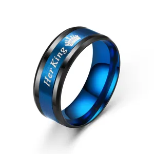 Stainless steel couple ring detail, blue and black brushed design with crown and text engraving.