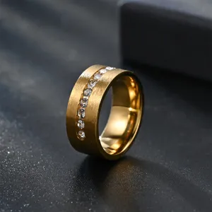 Men's 8mm wide gold plated matte brushed ring featuring a stunning center row of clear stones.