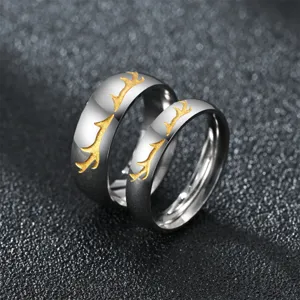 Stainless steel couple rings set with elegant golden deer antler design for lovers.