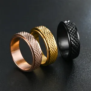 Bague anti-stress en acier inoxydable avec motif losange géométrique, gros plan de trois couleurs.