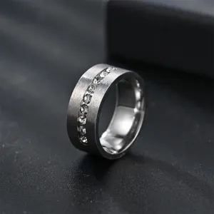 Men's 8mm matte brushed stainless steel ring featuring a center line of sparkling crystal stones.