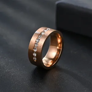 Detailed close-up of men's 8mm matte brushed ring with sparkling zirconia stones.