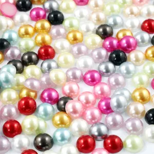 Detailed close-up shot showing mixed colors and glossy finish of half-round flatback pearls.