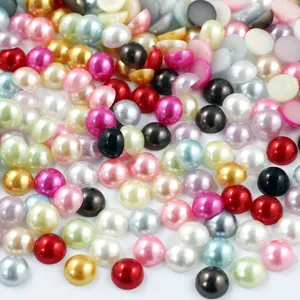 Macro detail shot showing mixed color half round pearls, flatback imitation pearls for DIY crafting.