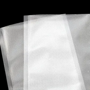Detailed close-up view of clear textured vacuum food sealer bags, moisture-proof storage.