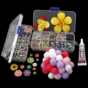 DIY phone case rhinestone material kit with storage box, colorful pom poms and resin flower charms.
