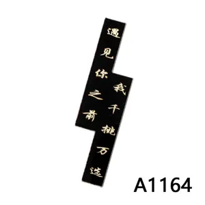 Black lightning acrylic patch detail with gold Chinese text, perfect for DIY phone case crafting.