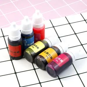 Closeup of colorful liquid pigment dye bottles for resin epoxy DIY art crafting, 10g.