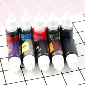 Close up detail of colorful epoxy resin liquid pigment squeeze bottles for DIY crafts.