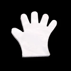Transparent disposable PE plastic gloves detail view, hygienic food preparation tool.