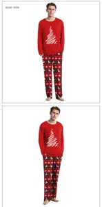 Christmas pajama set detail view featuring red long sleeve top and festive printed pants.