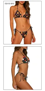 Christmas printed bikini set detail view featuring halter triangle top and side tie bottoms.