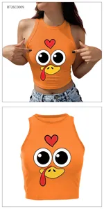 Detail view of the orange Thanksgiving turkey crop top showing the cute cartoon print.