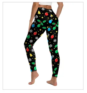 Christmas print detail showing festive baubles and snowflakes on high-waisted leggings.