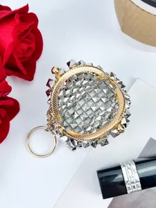 Punk style silver rivet coin purse with gold kiss lock frame and keychain pendant.