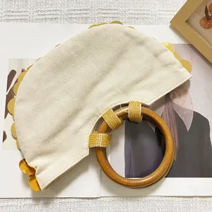 Beige Canvas Semicircular Handbag With Wooden Ring Handle And Gold Sequins Detail