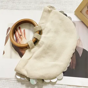 Canvas evening handbag with wooden handle and silver sequins detail, chic style.