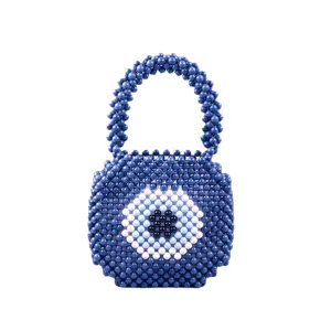 Sac à main élégant en perles acryliques bleues avec un design tendance d'œil turc, idéal pour l'été.